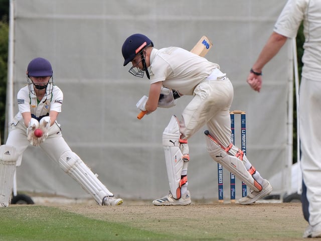 Bridlington 2nds keeper Scarlet Brooks claims the ball while batter Harley Adams looks on