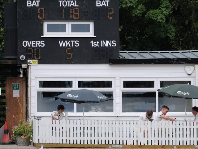 The rest of the Seamer team look on