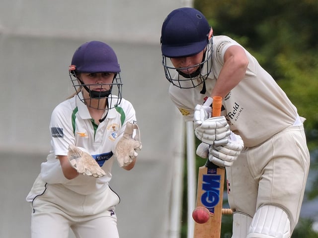 Seamer & Irton batter Harley Adams fends the ball away, with Bridlington 2nds keeper Scarlet Brooks looking on