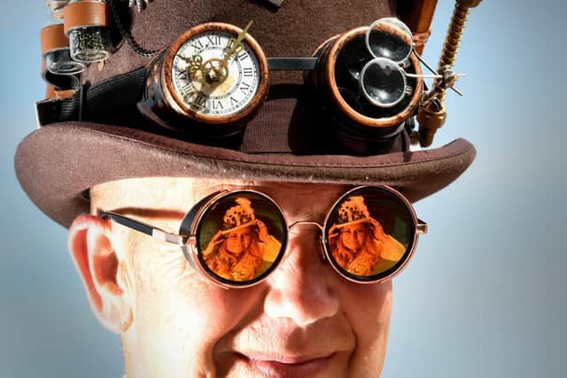 Kev Havercroft is pictured with his wife Emma reflected in his glasses. The couple were at the Whitby Steampunk Weekend which attracted thousands to the sea-side town. Picture by Simon Hulme 23rd July  2022