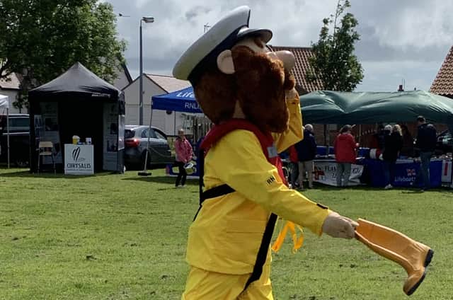 RNLI mascot Stormy Stan tries welly wanging at a past event. Photo submitted