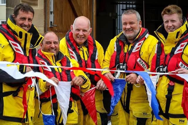 From left: RNLI crew members Richard Dowson, Anthony Gibbon, Keith Attridge, Howard Fields and Andy Brighton prepare for the weekend's fundraiser.