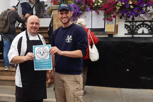 Paul Gildroy, Chef at the Magpie Cafe, Whitby, with Joe Redfern, manager of Whitby's Lobster Hatchery.