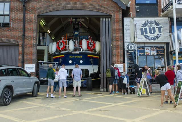 A throng of tourists outside the RNLI station at Filey.