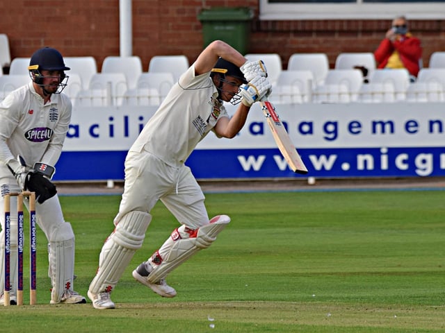 Flixton's Elliot Hatton plays back past the bowler