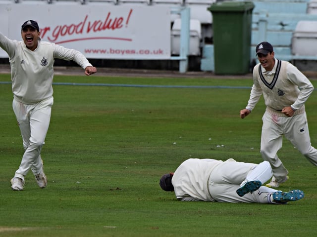 Scarborough celebrate as keeper Duncan Brown takes a smart low down catch