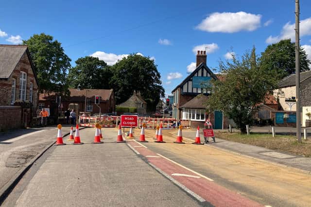 The A64 has been closed outside the Coach and Horses pub, due to the sinkhole.