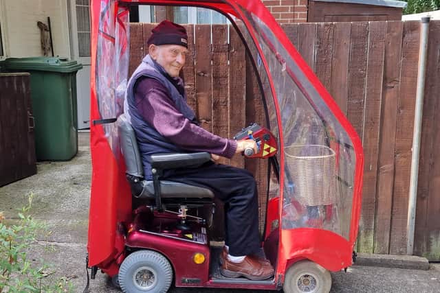 Disabled pensioner Derek Chamberlain back on the repaired mobility scooter. Photo submitted