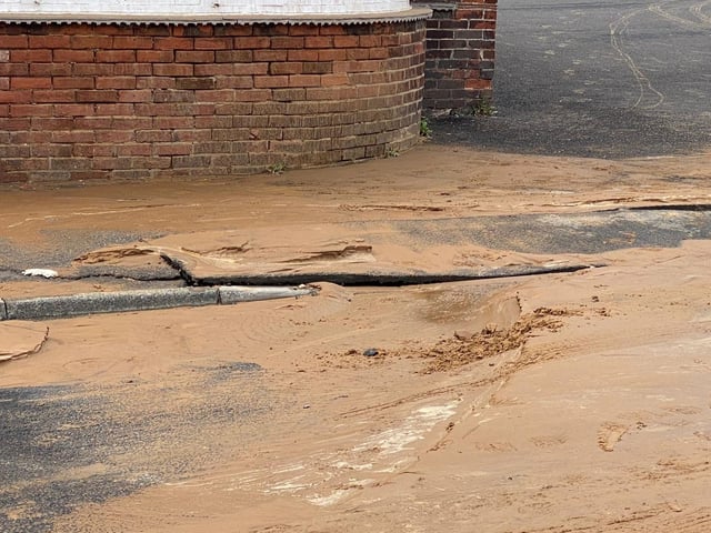 Cracks appears in road and pavement before the surface collapses.