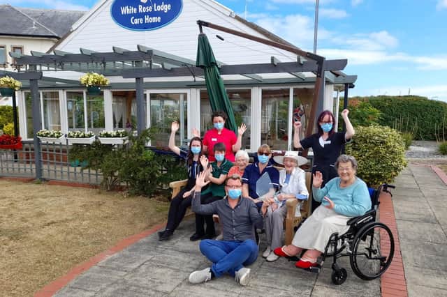 White Rose Lodge care home staff and residents celebrate the success at the recent MMCG and Countrywide Care Awards. Photo submitted