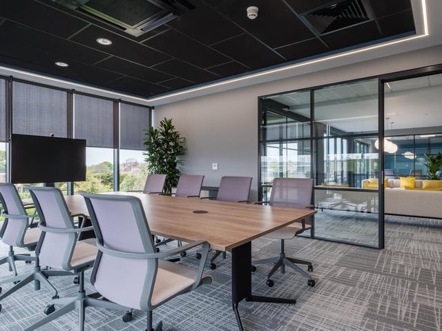 A specially-designed conference room table has been installed which allows everyone to be seen on camera during virtual meetings.