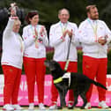 Bronze medalists Susan Wherry, Alison Yearling, Chris Turnbull and Mark Wherry of Team England celebrate on the podium.  (Photo: Nathan Stirk/Getty Images)