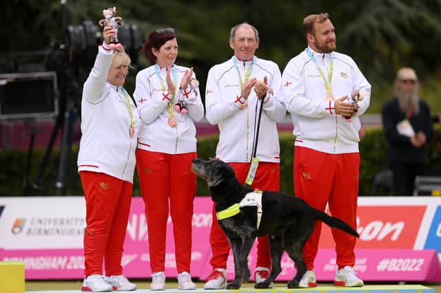 Bronze medalists Susan Wherry, Alison Yearling, Chris Turnbull and Mark Wherry of Team England celebrate on the podium. (Photo: Nathan Stirk/Getty Images)