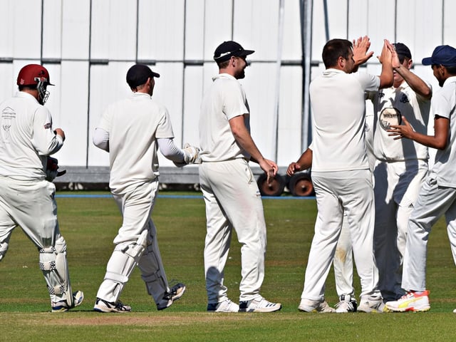 Charlie Hopper celebrates bagging one of his wickets