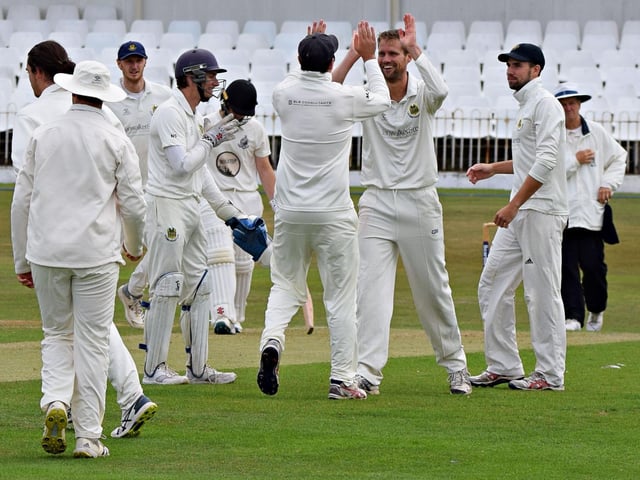 Acomb celebrate the fall of a home wicket