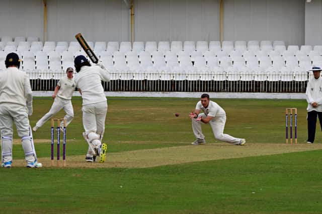 Scarborough spinner Linden Gray fields off his own bowling
