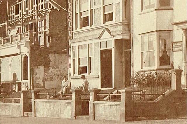 This vintage postcard shows two ladies seated outside the Regency era house that’s now a rock shop and holiday complex. Postcard courtesy of Aled Jones