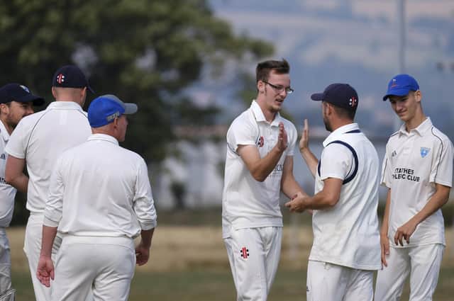 Staithes congratulate Brad Lewis for dismissing Heslerton batter Andrew Slaughter
Photos by Richard Ponter