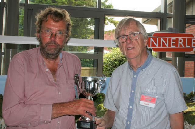 David Harrison is presented with the Steve Waring Memorial Trophy by Trainshed chairman Mike Brayshaw. Photo submitted