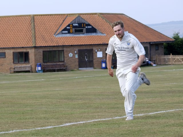 A Staithes fielder looks to stop a boundary