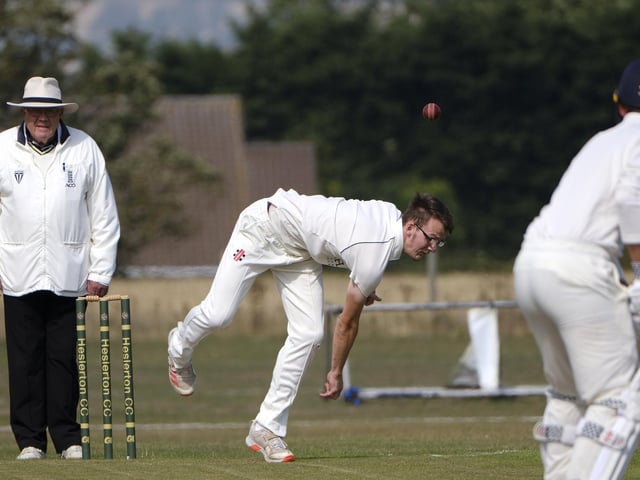 Brad Lewis in bowling action for Staithes at Heslerton