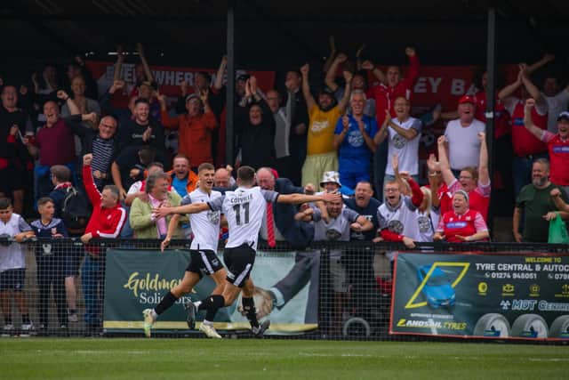 The large travelling support cheer Will Jarvis' second goal

Photo by Matthew Appleby
