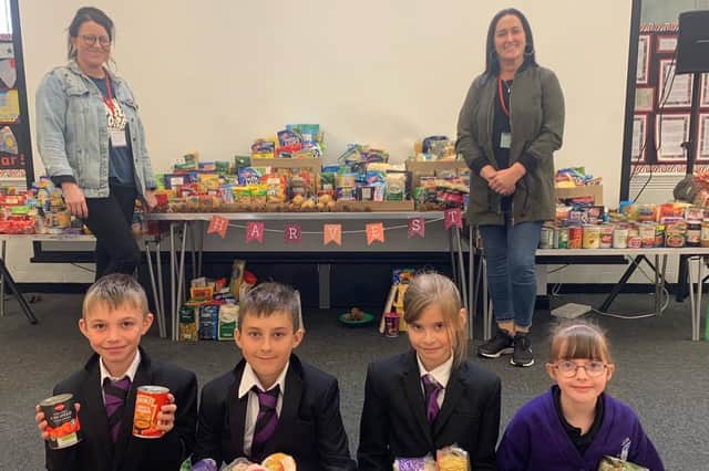 Quay Academy pupils with Emma and Toni from the Re-Store food bank charity.