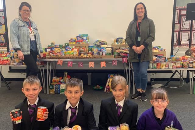 Quay Academy pupils with Emma and Toni from the Re-Store food bank charity.