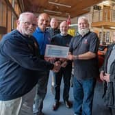 Ian Dewar (left) from the Yorkshire Veterans Model Group presents a cheque for £200 to Bob Taylor (Brid RNLI). Photo: Mike Milner/RNLI