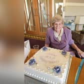 Peggy Lambert with her 100th birthday cake
