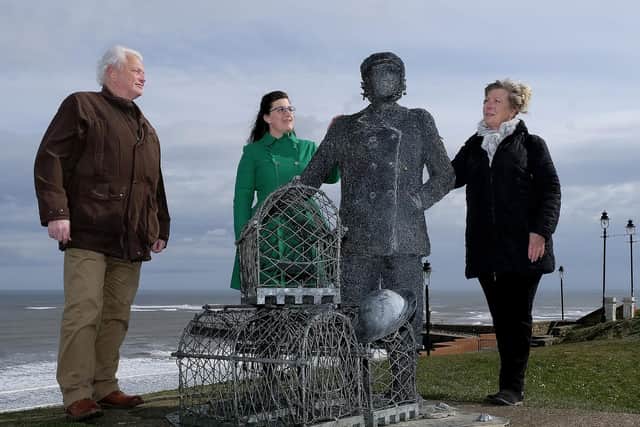 Whitby Museum Shipping Curator Dennis Buck, Whitby's Civic Treasurer Janet Kukk, and Dora Walker's great niece Zoe Taylor admire a sculpture by Emma Stothard to honour Whitby's first female skipper. The Civic Society is now to remember Dora Walker with a blue plaque. Image by Richard Ponter.
