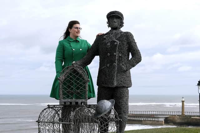 Zoe Taylor beside a statue from Emma Stothard to honour her great aunt Dora Walker. The Whitby Civic Society is now to dedicate a blue plaque to Whitby's first female skipper. Image by Richard Ponter.
