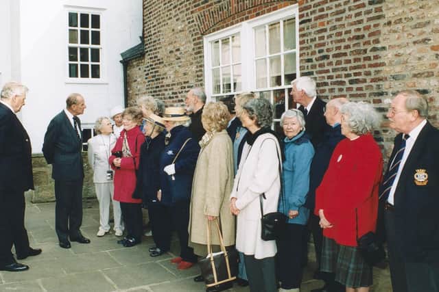 Prince Philip meets guests in the grounds of the Captain Cook Museum.
