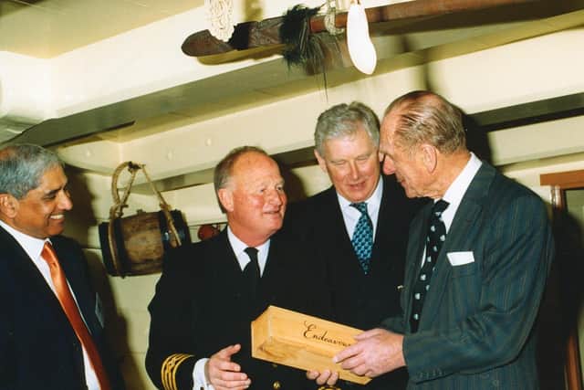 Prince Philip meets Capt Chris Blake on board HM Bark Endeavour in Whitby.