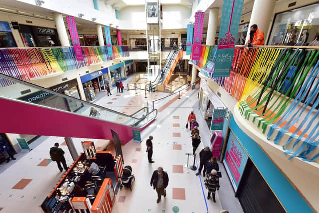 Colourful streamers decorate the Brunswick Shopping Centre as customers returned.