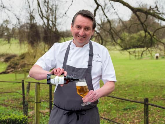 James Mackenzie pours a glass of InnSpire - Photo by Chris Manson Photography