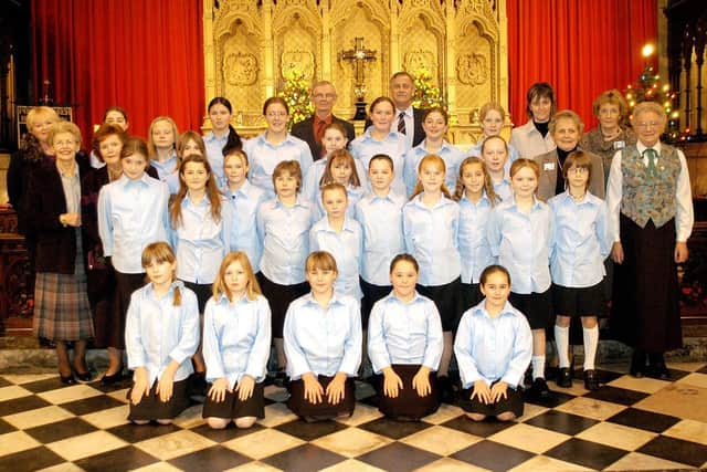 Bridlington Girls Choir are pictured with Macmillan nurses and volunteers at the Priory Church ahead of the Macmillan Carol Concert in 2003. Are you featured in the picture? Photograph taken by Paul Atkinson (PA0350-29)
