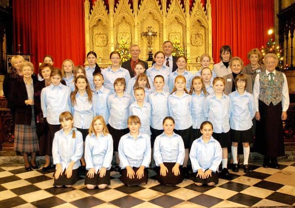 Bridlington Girls Choir are pictured with Macmillan nurses and volunteers at the Priory Church ahead of the Macmillan Carol Concert in 2003. Are you featured in the picture? Photograph taken by Paul Atkinson (PA0350-29)