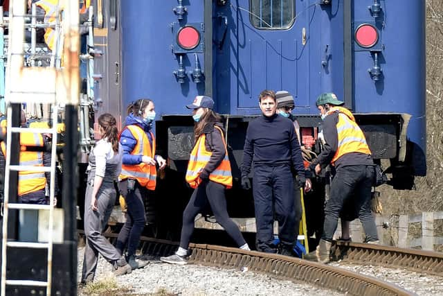 Tom Cruise prepares for an action scene at Levisham Station.