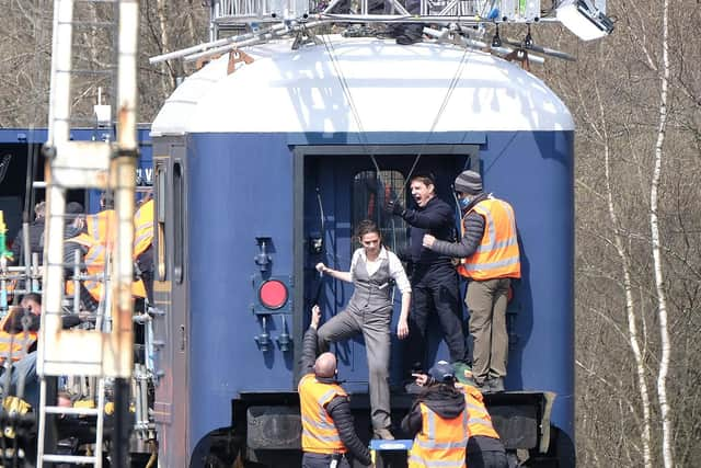 Tom Cruise and Hayley Atwell on a specially constructed train carriage.