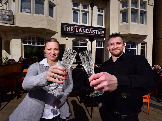 Managers Lelde Caune and Ray Clarkson make a toast to the big opening day.