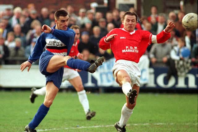 CLUB LEGEND: Paul Pitman who scored Whitby’s late winner fires in a shot past the Banstead defence