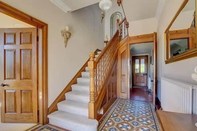 Hallway with original tiled floor