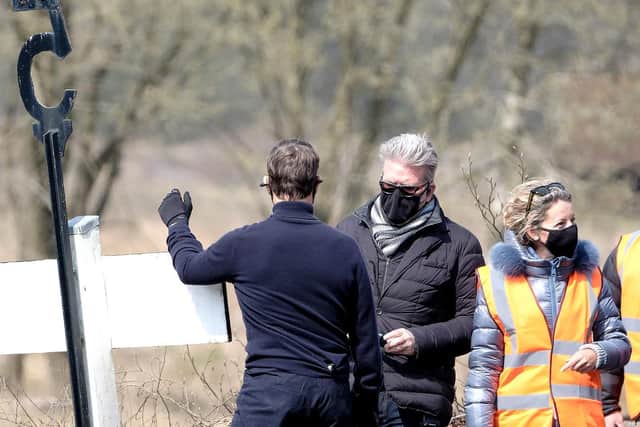 Director Christopher McQuarrie was pictured chatting on set with Tom Cruise.