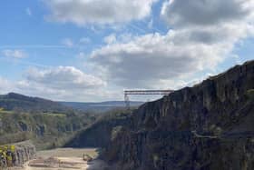 A huge bridge has been constructed over the edge of a disused quarry in Derbyshire.
