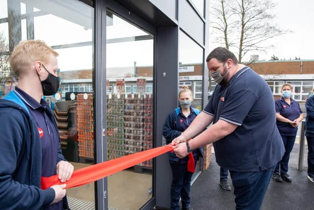 Ribbon cutting to unveil the new The Food Warehouse store in Whitby.