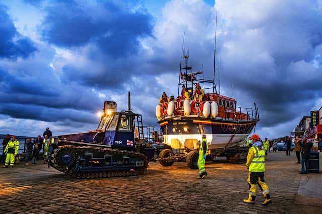 The tractor tows the ALB off Coble Landing for the final time