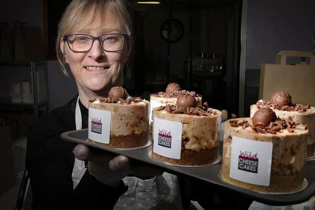 Nicola Ellis-Nichol shows off some of the cheesecakes