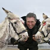 Guy Smith and his donkeys on South Bay beach.