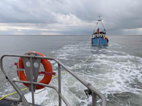 Scarborough RNLI tows the fishing boat back to the harbour. (Photo: Erik Woolcott)